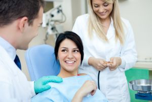 A woman smiling after a successful dental visit.