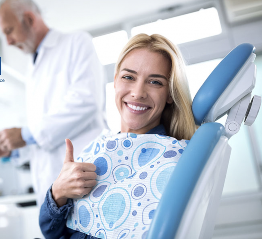 A smiling woman, happy to be a member of the dental care membership plan
