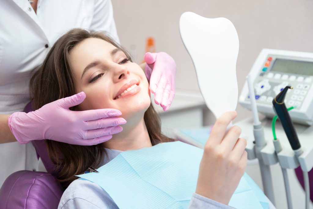 Girl at cosmetic dentistry appointment in dental office