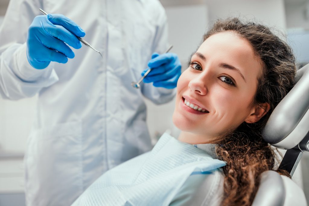 A delighted new patient enjoying the care at Gloss Dental